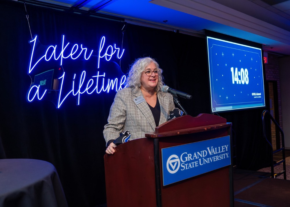 Susan Proctor talking to students with countdown in the background